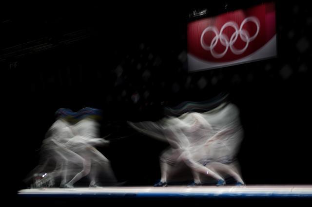 万博体育-日媒:菅义伟不考虑取消奥运 男重团体金牌“悲愿”